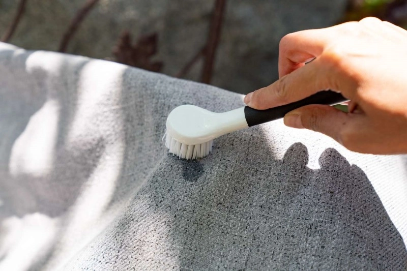 A soft brush cleaning sofa upholstery
